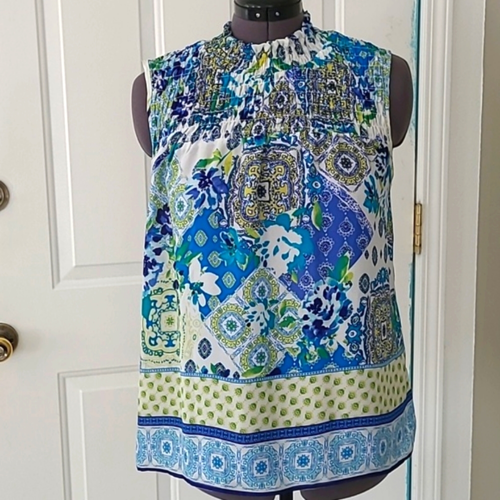 Chenault Smocked Upper all-around neckline, sleeveless.